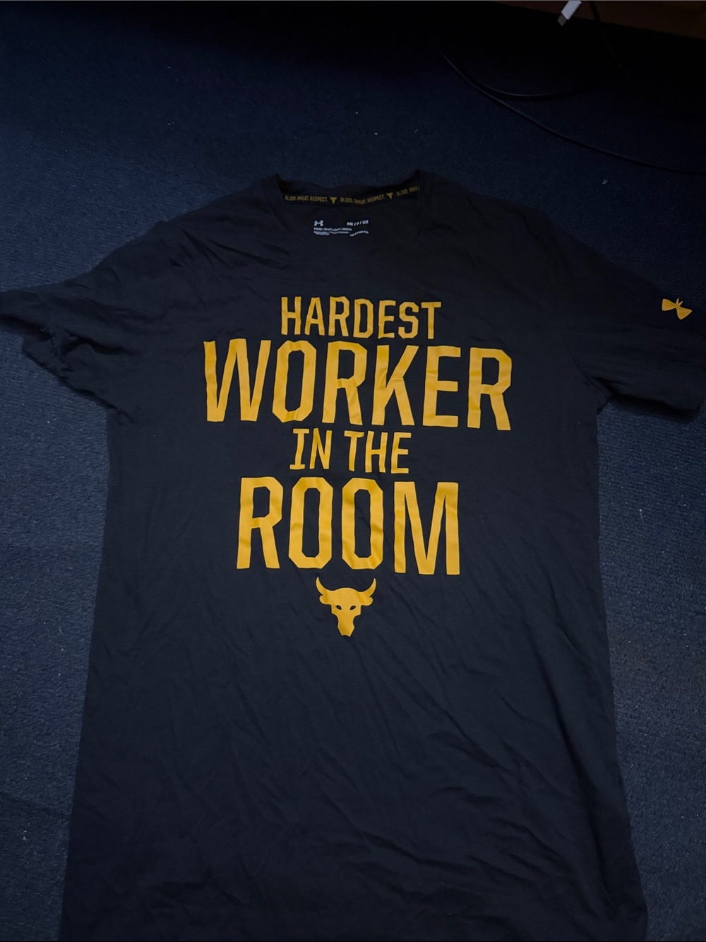 Under Armour Black Short Sleeve Tee with Gold 'Hardest Worker' Graphic